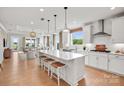 Bright, open kitchen with a large island, white cabinets, and stainless steel appliances at 4775 Formation Dr # 99, Lancaster, SC 29720