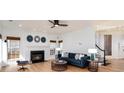 Comfortable living room includes cozy fireplace and natural light, creating an inviting atmosphere at 5672 Wrenfield Ct, Charlotte, NC 28277