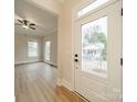 Bright and open living room with vinyl floors, large windows, and views of the outdoors at 576 Reid St, Belmont, NC 28012