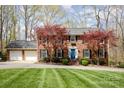 Beautiful brick home featuring a two-car garage and lush landscaping, offering curb appeal and convenience at 748 Saint Cloud Dr, Statesville, NC 28625