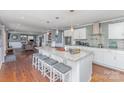 Bright kitchen with a granite island, modern appliances, and pendant lighting at 748 Saint Cloud Dr, Statesville, NC 28625
