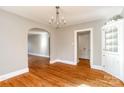 Dining room featuring hardwood floors, chandelier, and built in china cabinet at 904 Maple Ave, Salisbury, NC 28144