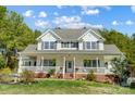 Charming two-story home featuring a spacious porch perfect for relaxing and enjoying the outdoors at 932 Dovefield Dr, York, SC 29745