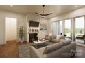 Cozy living room with fireplace, ceiling fan, and sliding glass doors to outdoor patio space at 00A Old Pardue Rd, Lancaster, SC 29720