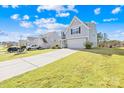 Attractive two-story home featuring a spacious driveway and a well-kept lawn in a friendly neighborhood setting at 120 Gray Hawk Dr, Rockwell, NC 28138