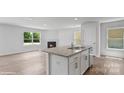 Bright kitchen featuring granite countertops, stainless steel appliances, and a view into the living room at 1346 37Th Avenue Ne Ln, Hickory, NC 28601