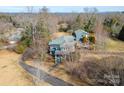 Expansive aerial view showcases the beautiful home, with a long drive and lush surroundings at 1740 12Th Street Nw Dr, Hickory, NC 28601