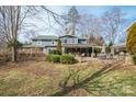 Relaxing covered patio with stone pillars and a spacious yard perfect for outdoor entertaining at 1740 12Th Street Nw Dr, Hickory, NC 28601