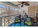 Relaxing outdoor patio with comfortable seating, fan, and scenic views at 19827 Henderson Rd # L, Cornelius, NC 28031