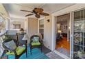 Inviting outdoor patio with comfortable seating, fan, and scenic views at 19827 Henderson Rd # L, Cornelius, NC 28031