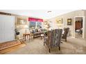 Comfortable living room with large window, neutral decor and decoratice furniture at 334 Hillcrest Dr, Mooresville, NC 28115