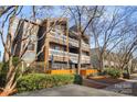 Condominium complex with gray siding, orange accents and multiple balconies at 434 W 8Th St, Charlotte, NC 28202