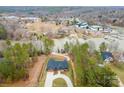 Expansive aerial view of a lakefront property with a modern home, long driveway, and serene surroundings at 4890 Rio De Luna None, Hickory, NC 28601
