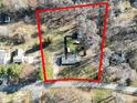 Aerial view of property showing the layout of the land, mature trees, and proximity to the road at 624 Patricia Ave, Harrisburg, NC 28075