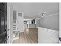 Bright entryway with views of the stairs, kitchen, and durable flooring at 6846 Colonial Garden Dr, Huntersville, NC 28078