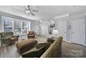 Bright living room featuring neutral walls, large window, and modern light-colored floors at 6846 Colonial Garden Dr, Huntersville, NC 28078