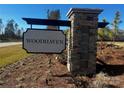 Stone monument sign for Woodhaven community with black trim and attractive landscaping at 808 N Naughton St, Chester, SC 29706