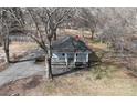 Birds eye view of a quaint home with a cozy porch and surrounding trees at 934 W Nc 150 Hwy, Lincolnton, NC 28092