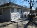 The home's back exterior shows a small deck, siding, and rain gutters at 934 W Nc 150 Hwy, Lincolnton, NC 28092
