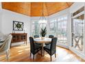 Bright dining room featuring a wood plank ceiling, many windows, and hardwood floors at 1025 Seminole Dr, Waxhaw, NC 28173