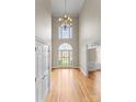 Grand foyer boasting soaring ceilings, hardwood floors, and a stunning chandelier at 1025 Seminole Dr, Waxhaw, NC 28173
