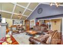 Bright living room with vaulted ceiling, recessed lights, hardwood floors, and comfortable furniture throughout at 108 Outside Loop Ln, Mooresville, NC 28117