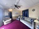 Inviting living room featuring comfortable seating, nautical decor, and an open layout at 110 Shawnee Trl, Mount Gilead, NC 27306