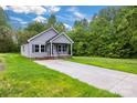 Attractive home with a well-kept lawn, concrete driveway, and welcoming front porch at 117 Lippard St, Statesville, NC 28677