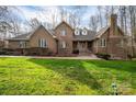 Spacious two-story brick home featuring a manicured lawn and beautiful landscaping at 1816 Country Garden Dr, Shelby, NC 28150