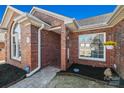 Welcoming brick entrance with a detailed walkway, garden, and beautiful windows at 1911 Connemara Ct, Gastonia, NC 28054