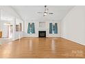 Spacious living room featuring a fireplace, hardwood floors, and ample natural light at 2018 Arlington Ave, Statesville, NC 28677