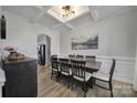 Spacious dining room featuring a coffered ceiling, and a dark wood dining table with seating for eight at 2167 Whispering Winds Dr, Rock Hill, SC 29732