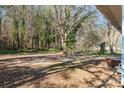 Spacious backyard featuring mature trees providing shade and a private outdoor space for relaxation and recreation at 3030 Crawford Ave, Gastonia, NC 28052