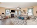 Spacious living room features a fireplace, large windows, and comfortable seating at 4214 High Shoals Dr, Monroe, NC 28110