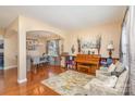 Open-concept living and dining area featuring hardwood floors and lots of natural light at 4214 High Shoals Dr, Monroe, NC 28110