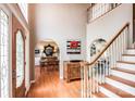 Inviting home foyer with hardwood floors, high ceilings, and staircase leading to the second floor at 4825 1St Street Nw Ct, Hickory, NC 28601