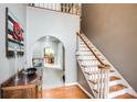 Warm foyer with staircase and view into living spaces, featuring hardwood floors and neutral paint at 4825 1St Street Nw Ct, Hickory, NC 28601