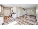 Modern kitchen with stainless steel appliances, granite countertops, and hardwood flooring at 509 Holly St, Statesville, NC 28677