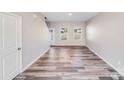 Bright living room with hardwood floors, neutral walls, with ample natural light from the windows at 509 Holly St, Statesville, NC 28677