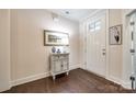 Inviting foyer featuring gleaming hardwood floors, a stylish accent table, and elegant decor at 517 Red Wolf Ln, Clover, SC 29710