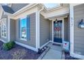 Close-up featuring an inviting front door, accented with a festive wreath and charming decor at 517 Red Wolf Ln, Clover, SC 29710