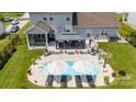 Aerial view of the backyard oasis featuring a swimming pool, lounge chairs, and a gazebo at 7133 Sumters Camp Trl, Fort Mill, SC 29707