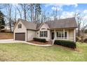 Charming single-Gathering home features a covered front porch, attached two car garage, and manicured lawn at 910 Pine Knoll Rd # 13, Fort Mill, SC 29715
