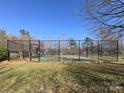Fenced basketball court in a community, providing a recreational space for residents to enjoy sports and outdoor activities at 10125 Westmoreland Rd, Cornelius, NC 28031