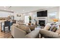 Open-concept living room with fireplace, and an abundance of natural light creating a relaxing atmosphere at 11518 Solstice Way, Huntersville, NC 28078