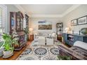 Cozy living room with a comfortable seating arrangement, elegant decor, and hardwood floors at 1263 Crooked Stick Dr, Rock Hill, SC 29730