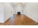 Spacious living room with fireplace, hardwood floors, and large windows offering ample natural light at 2068 Brandt Rd, York, SC 29745