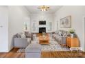 Bright, staged living room featuring high ceilings, fireplace, hardwood floors, and abundant natural light at 2068 Brandt Rd, York, SC 29745