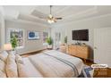 Staged main bedroom with tray ceiling, hardwood flooring, and decorative plant accents at 2068 Brandt Rd, York, SC 29745