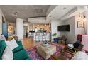 Open-concept living area featuring concrete ceilings, kitchen, workspace, and bedroom at 210 N Church St # 1413, Charlotte, NC 28202